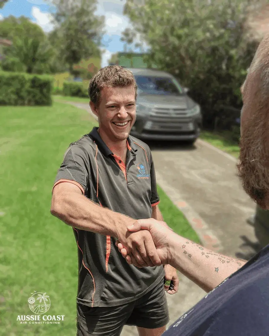 Technician shaking hands with a satisfied customer