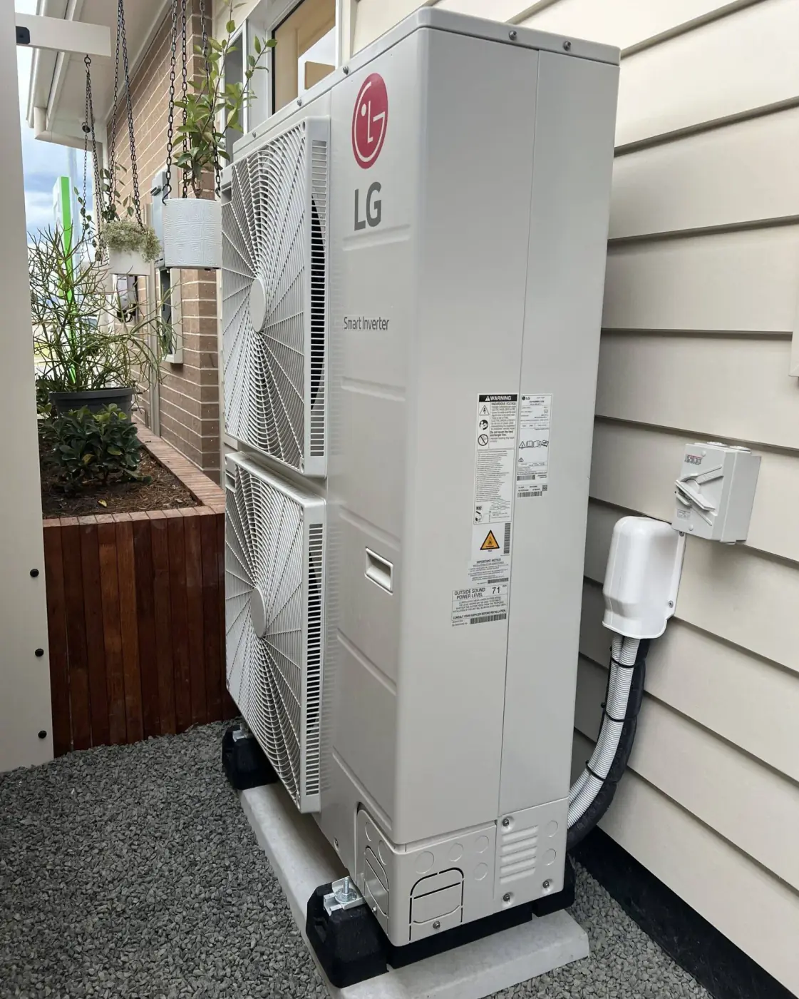 Ducted air conditioning outdoor unit on a concrete base