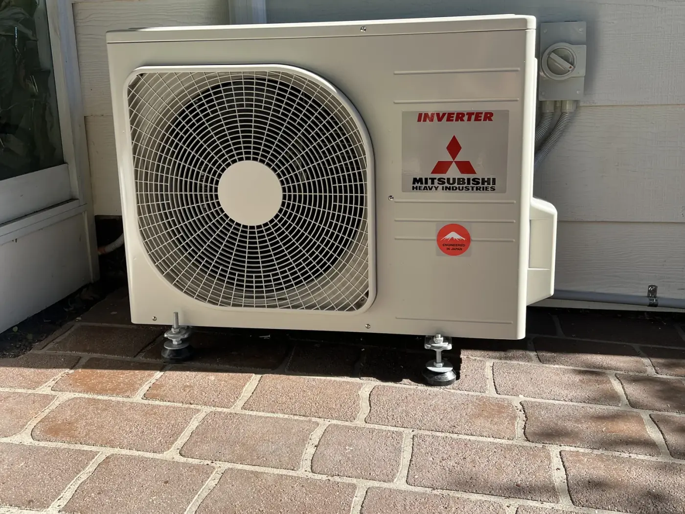 Mitsubishi Heavy Industries split system outdoor unit installed on adjustable feet by Aussie Coast Air