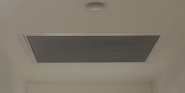 White return air grille in a white ceiling